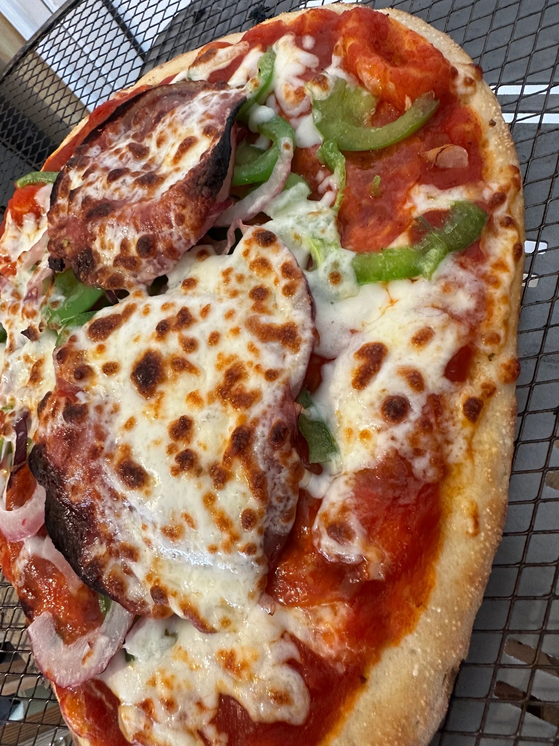 Cheesy flatbread pizza with peppers and pepperoni