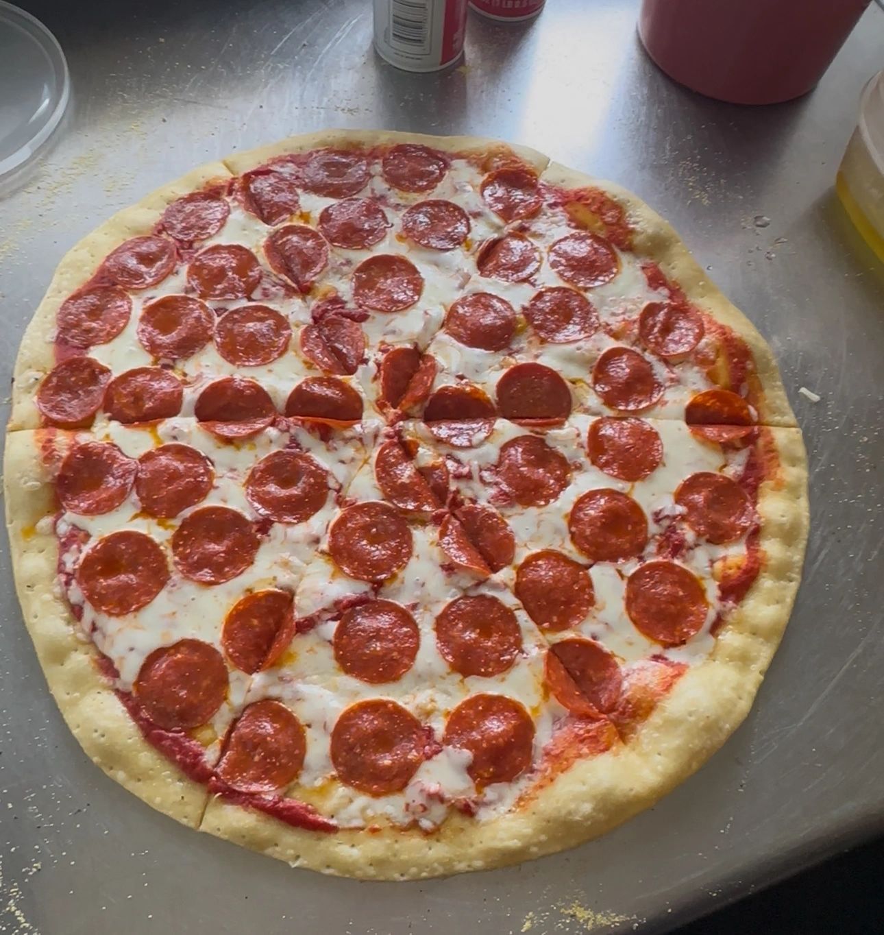Whole pepperoni pizza fresh from the oven at The Spot on 10th